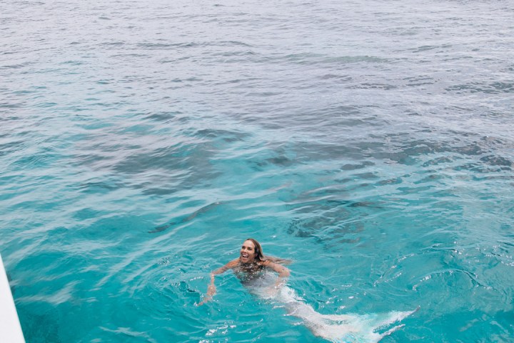 a person swimming in a pool of water