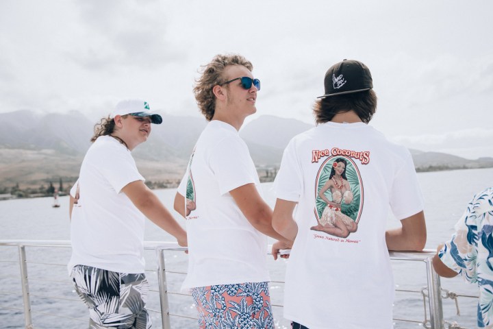 a group of people standing in the water