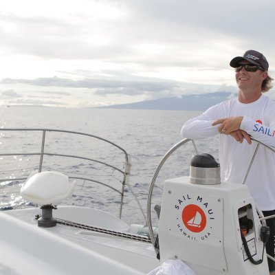 a man riding on the back of a boat