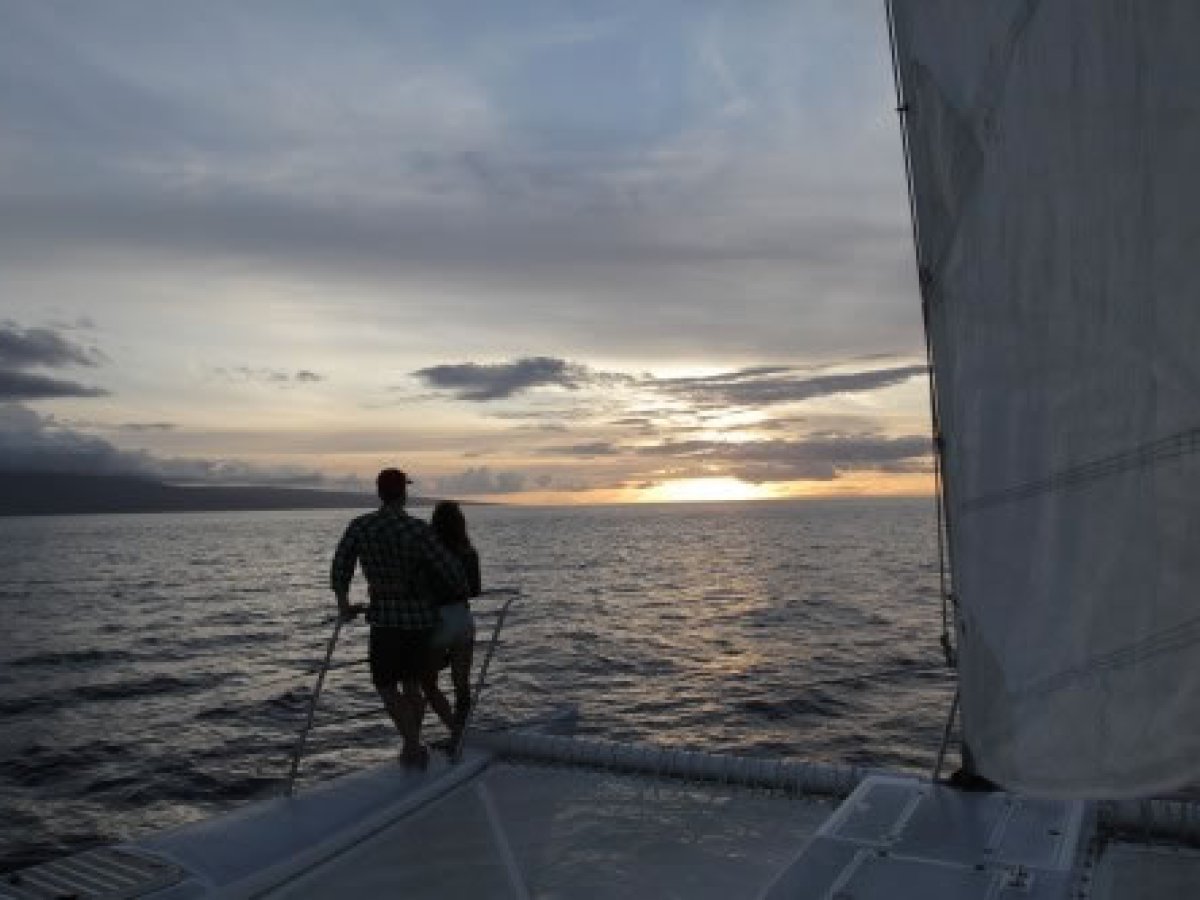 a person standing next to a body of water