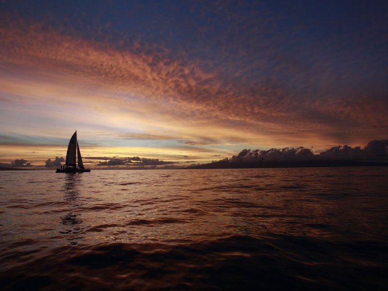 a sunset over a body of water