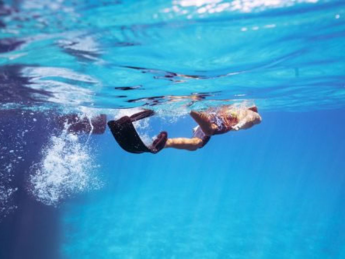 a person swimming in a pool of water
