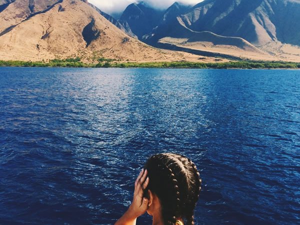 a person standing in front of a body of water
