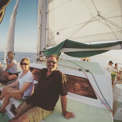 a group of people on a boat posing for the camera