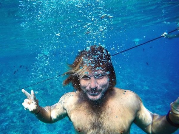 a man swimming in a pool of water