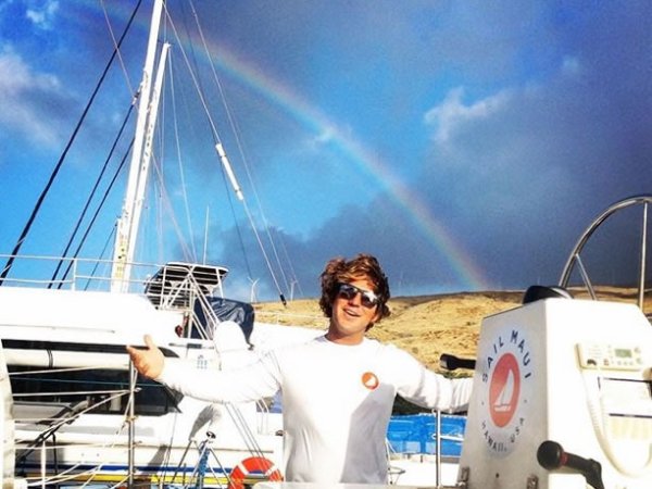 a person standing next to a boat