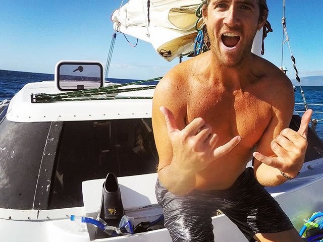 a man holding a glass of water