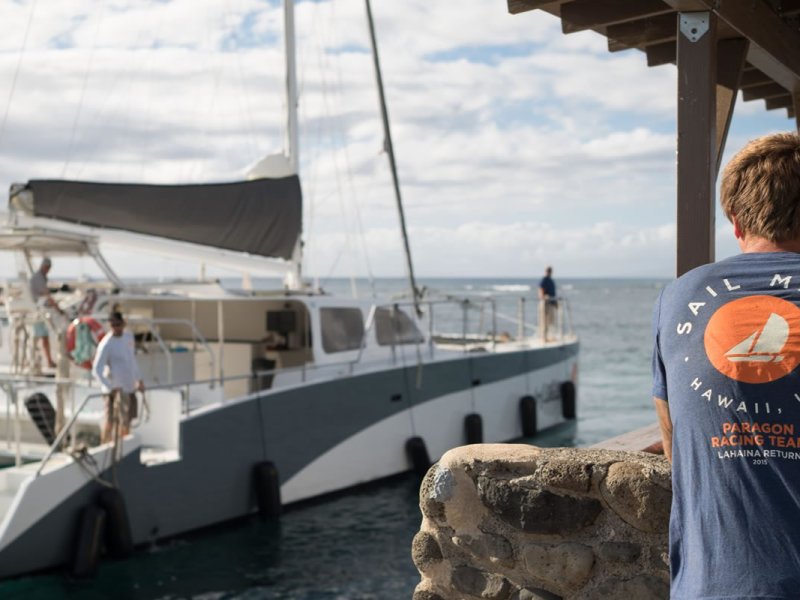 a man standing in front of a boat