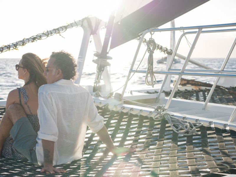 a man and a woman standing on a bridge