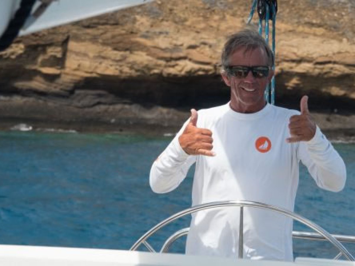 a man holding a fish in the water