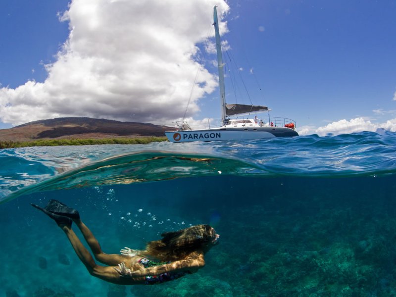 a close up of a boat next to a body of water