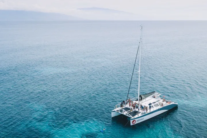 a small boat in a large body of water