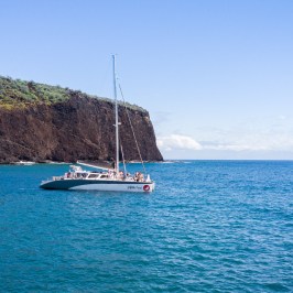 a small boat in a large body of water