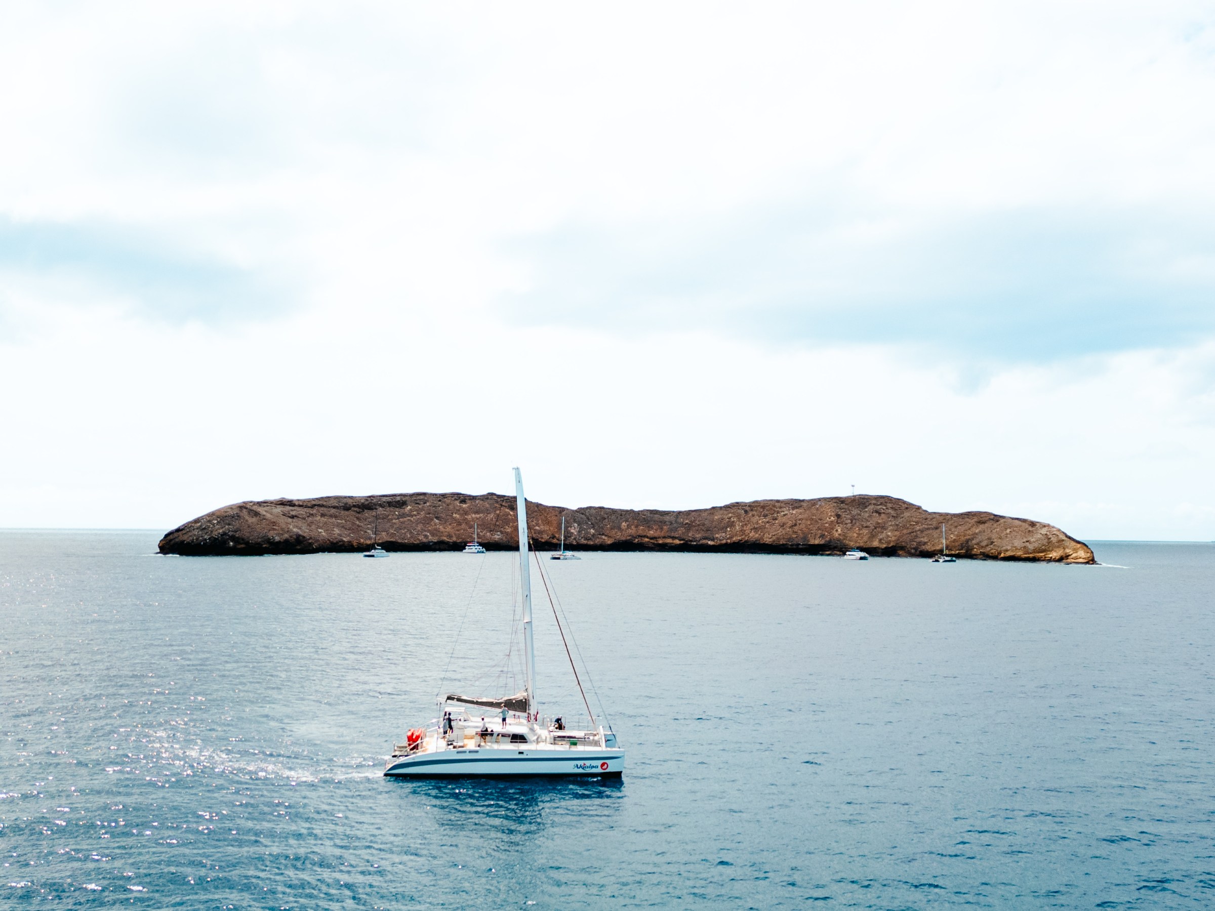 a small boat in a large body of water