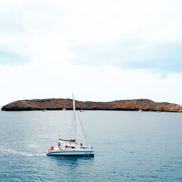 a small boat in a large body of water